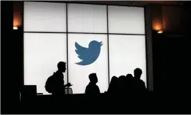  ?? Photograph: Glenn Chapman/AFP via Getty Images ?? Twitter employees leave the company’s headquarte­rs in San Francisco in 2019.