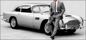  ?? ?? LICENCE TO SHORT: Daniel Craig as James Bond with his Aston Martin