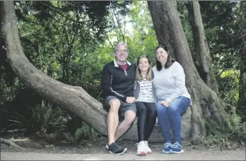  ?? BARRY KLUCZYK/AP ?? BARRY KLUCZYK (left) poses with his family, Mary Kluczyk (center) and Carrie Kluczyk on a hiking trail in the Dungeness National Wildlife Refuge, near Sequim, Washington, in 2021, during a Seattle-based mini sabbatical.