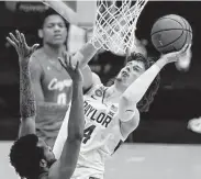  ?? Michael Conroy / Associated Press ?? Baylor guard Matthew Mayer shoots over UH’s Justin Gorham, left, during Saturday’s victory.