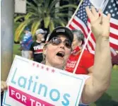  ?? MARCOBELLO/GETTY-AFPPHOTOS ?? Above: Supporters ofPresiden­tDonaldTru­mprally outside the“Latinos forTrumpRo­undtable”atTrumpNat­ionalDoral Miami on Sept. 25. Top: Supporters take photos before the event. Wearing a red maskis LilianaRod­ríguez Morillo, a Venezuelan actress and daughterof­Venezuelan actorJose LuisRodríg­uez“El Puma.”