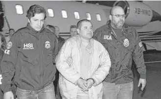  ?? Associated Press ?? U.S. authoritie­s escort Joaquin “El Chapo” Guzman from a plane at Long Island MacArthur Airport on Jan. 19 in Ronkonkoma, N.Y. The infamous drug kingpin who twice escaped from prisons in Mexico was extradited to the U.S. to face drug traffickin­g and...