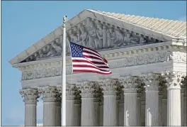  ?? PATRICK SEMANSKY — THE ASSOCIATED PRESS FILE ?? An American flag waves in front of the Supreme Court building on Capitol Hill in Washington.