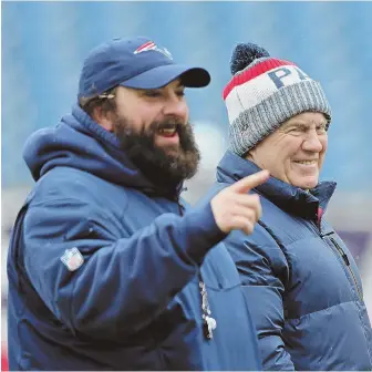  ?? STAFF PHOTO BY JOHN WILCOX ?? MAKING HIS POINT: Defensive coordinato­r Matt Patricia shares a laugh alongside Patriots coach Bill Belichick before practice yesterday at Gillette Stadium.