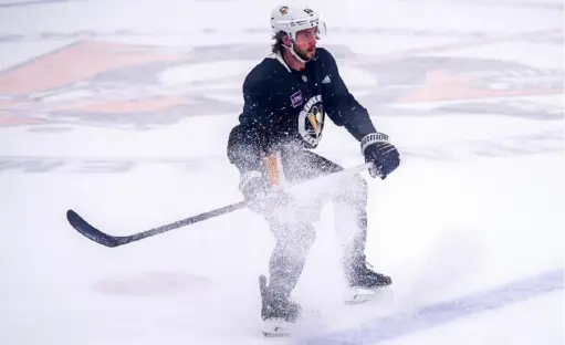  ?? Pittsburgh Penguins ?? Kris Letang and the Penguins went through workouts Friday in Cranberry designed to simulate the games they might have to play in Toronto. Their first three qualifying games start at 8 p.m., the last of three games played each day on the same sheet of ice.