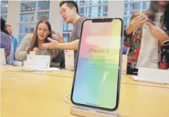  ?? RICHARD DREW/AP FILE ?? Apple’s iPhone X has a 5.8-inch screen. The company is expected to unveil its biggest and most expensive iPhone on Wednesday.