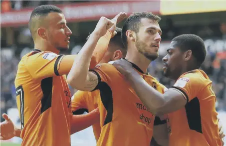  ??  ?? Brazilian striker Leo Bonatini celebrates scoring for Wolves against Preston back in October.