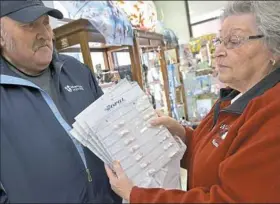  ?? Pam Panchak/Post-Gazette ?? Luida Shearer shows the prescripti­ons filled by Gatti Pharmacy in Indiana, Pa., in special packaging that helps her husband, Ron, keep track of his medication­s.