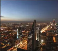  ?? (Bloomberg/Simon Dawson) ?? Light trails from traffic traveling along the King Fahd highway (left) in Riyadh, Saudi Arabia. For the first time in more than 70 years, a liquor store is opening in the city.