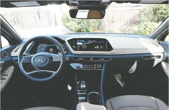  ??  ?? The infotainme­nt screen in the 2020 Hyundai Sonata is built in and the interior’s two-tone design screams luxury.