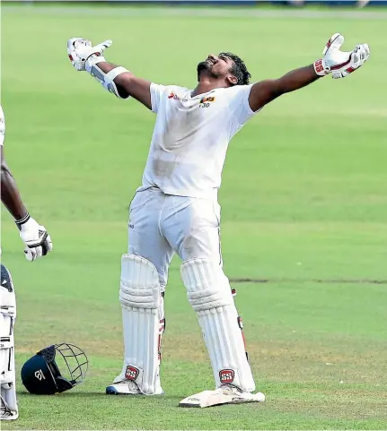  ?? GETTY IMAGES ?? Kusal Perera, right, celebrates one of the greatest wins in test cricket history, his memorable 153 not out guiding Sri Lanka to an unlikely one-wicket win over South African in Durban.
