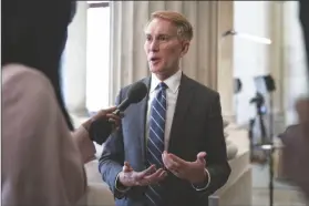  ?? J. SCOTT APPLEWHITE/AP ?? SEN. JAMES LANKFORD, R-OKLA., the lead GOP negotiator on the Senate border and foreign aid package, does a TV news interview on Capitol Hill at the Capitol in Washington on Monday.