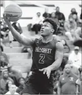  ?? JAMES C. SVEHLA/DAILY SOUTHTOWN ?? Hillcrest’s Mar’Keise Irving goes to the basket during Friday night’s game at Lemont. Irving scored 20 points.