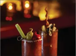  ?? PHOTO BY ARTEM KEVORKOV ?? The trick with bloody Marys, like this kosheresqu­e bloody Mary, is to mix the ingredient­s first before you add the ice.