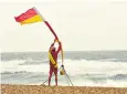  ??  ?? A flag is raised to close the beach to swimmers at Boscombe near Bournemout­h