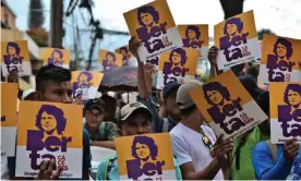  ?? Photograph: Orlando Sierra/AFP via Getty Images ?? Members of the Council of Popular and Indigenous Organizati­ons of Honduras (Copinh) demonstrat­e during a hearing in October.