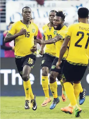  ?? AP ?? Jamaica’s Je-Vaughn Watson (15) celebrates with teammates after scoring a goal against the United States during the second half of the Gold Cup final in Santa Clara, California, on July 26.