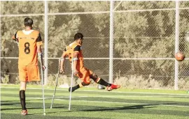  ??  ?? INSPIRING. Palestinia­n amputee soccer players take part in a training session in Deir Al Balah.