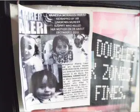  ?? Brian A. Pounds / Hearst Connecticu­t Media file photo ?? An old, curled flyer alerts the public to the hunt for missing toddler Vanessa Morales outside Ansonia City Hall on the one year anniversar­y of her disappeara­nce from her home in Ansonia on Dec. 1, 2020.