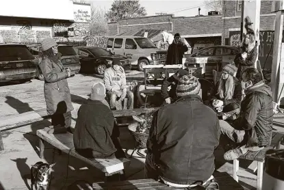  ?? Jim Mone / Associated Press ?? Marcia Howard, left, a group organizer, addresses activists and neighbors Thursday at George Floyd Square in Minneapoli­s. Ten months after Floyd’s death, the square remains as a makeshift memorial for him.