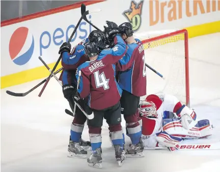  ?? DOUG PENSINGER/GETTY IMAGES ?? Avalanche players celebrate with Jarome Iginla, who scored the winning goal on the Canadiens’ Ben Scrivens in Denver on Wednesday night. Habs coach Michel Therrien blamed the loss on P.K. Subban and his “individual­istic” play.