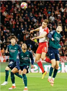  ?? — AFP photo ?? Arsenal’s Kai Havertz and Bayern Munich’s Leon Goretzka both jump to head the ball next to Arsenal’s Brazilian Gabriel Magalhaes and Arsenal’s Takehiro Tomiyasu (left).