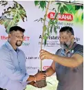  ??  ?? Director Operation M. I. Wahid hands over plant to Breeder Farm Manager Chaminda Sampath