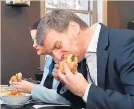  ?? Marty Melville ?? Prime Minister Bill English rated his burger sophistica­ted.