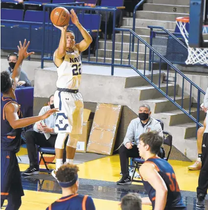  ?? PAULW. GILLESPIE/ CAPITAL GAZETTE ?? Navy guard Cam Davis, seen making a 3- pointer during Saturday’s game against Bucknell at Alumni Hall in Annapolis, drained a go- ahead jumper with five seconds left then added a pair of free throws to lead the Mids past the Bison again on Sunday.