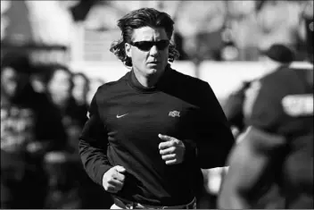  ?? ASSOCIATED PRESS ?? IN THIS NOV. 2, 2019, FILE PHOTO, Oklahoma State coach Mike Gundy runs onto the field before the team’s game against TCU in Stillwater, Okla.