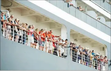  ?? SPM ?? MS Westerdam passengers wave as the ship docks in Cambodia after being denied entry by several other countries at the outset of the Covid-19 pandemic in 2020.