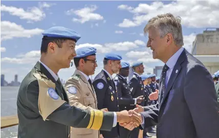  ??  ?? Lieutenant colonel Duanmu Donglin (front left) from China is awarded the UN Peacekeepi­ng Medal, which was presented by UN Undersecre­tary-General for Peacekeepi­ng Operations Jean-Pierre Lacroix, at the UN headquarte­rs in New York, May 24, 2019.