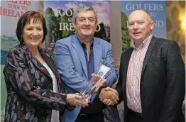  ??  ?? Portmarnoc­k Hotel and Golf Links’ Moira Cassidy and Fintan Brennan receive the Best Links, Leinster Award from Paddy McCarthy at the 2018 Golfers Guide to Ireland Awards.