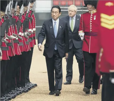  ?? PICTURE: DAN KITWOOD/PA WIRE ?? PEACE MOVE:
Boris Johnson welcomes Japanese Prime Minister Fumio Kishida at the Guard of Honour yesterday.