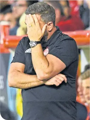  ??  ?? Aberdeen boss Derek Mcinnes feels the pain at Pittodrie last Thursday night