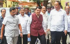  ?? PTI ?? ■ Maharashtr­a Chief Minister Devendra Fadnavis along with other BJP legislator­s arrives to attend a meeting on the Maratha reservatio­n issue in Mumbai yesterday.