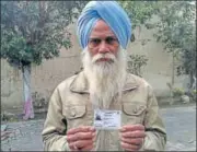  ?? HT PHOTO ?? Lachhman Singh shows his PAN card in Sangrur on Friday.