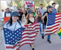  ?? AP PHOTO ?? Deferred Action for Childhood Arrivals (DACA) supporters march to the Immigratio­n and Customs Enforcemen­t office to protest shortly after U.S. Attorney General Jeff Sessions’ announceme­nt that the Deferred Action for Childhood Arrivals (DACA), will be...