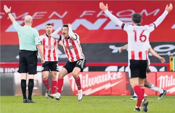  ?? Stu Forster ?? Sheffield United’s Ethan Ampadu leads the appeals for a penalty in the clash with Plymouth Argyle, but they were rejected after a VAR review