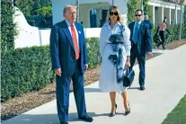  ?? WILFREDO LEE/THE ASSOCIATED PRESS ?? Republican presidenti­al candidate Donald Trump and former first lady Melania Trump pause to speak outside their voting location Tuesday in Palm Beach, Fla. “I voted for Donald Trump,” he said.