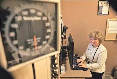  ?? STAFF PHOTO BY MARK GARFINKEL ?? MORE THAN JUST A JOB: Anne Krekis, a nurse practition­er at Atrius Health’s Harvard Vanguard Medical Associates office in Copley Square, says she’s ‘never dreaded going to work.’