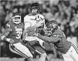  ?? [AP PHOTO] ?? Oklahoma senior defensive end D.J. Ward sacks Texas Tech quarterbac­k Nic Shimonek in last week’s game. Ward’s success has helped the Sooners’ defense find different ways of applying pressure.