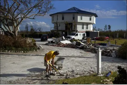  ?? CALLAGHAN O’HARE — THE NEW YORK TIMES ?? Cleanup continues in the aftermath of Hurricane Ian in Fort Myers Beach, Fla., on Oct. 5. The hurricane’s record- breaking cost will make it even harder for many to get insurance, experts say — threatenin­g home sales, mortgages and constructi­on.