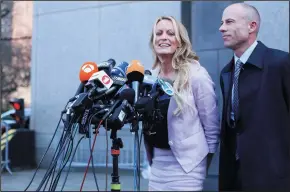  ?? ALEC TABAK/NEW YORK DAILY NEWS FILE PHOTOGRAPH ?? Stephanie Clifford, known as Stormy Daniels in the adult film industry, is interviewe­d alongside her former lawyer Michael Avenatti as she leaves Manhattan Federal Court on April 16, 2018 in New York.