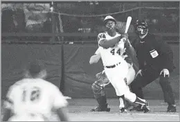  ?? Harry Harris Associated Press ?? MAKING HISTORY
The Braves’ Hank Aaron watches the record-breaking 715th home run of his career in a game against the Dodgers in Atlanta on April 8, 1974.