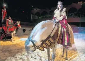  ?? JACOB LANGSTON/STAFF PHOTOGRAPH­ER ?? Christina Carmona rehearses her role as queen at Medieval Times in Kissimmee last week. Medieval Times is giving a feminist premise to its show that features life in medieval times.