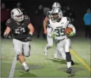  ?? PETE BANNAN — DIGITAL FIRST MEDIA ?? Pennridge’s Josh Pinkney (35) looks for an opening against Garnet Valley’s Josh Ciarrocchi (53) during their District 1-6A semifinal on Friday, Nov. 17, 2017.