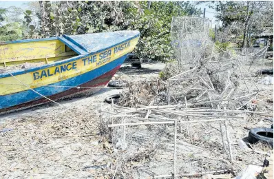  ?? ?? This damaged boat and broken fish pots told a story of what took place at Montego Bay Fishing Village last week.