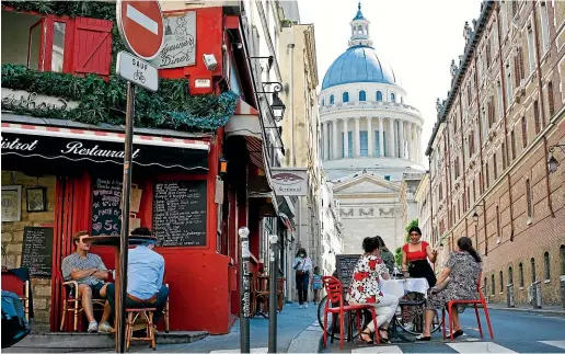  ?? AP ?? People sit on a terrace in Paris yesterday after City Hall authorised the reopening of outside seating areas for cafes and bars.