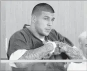  ?? TED FITZGERALD/ASSOCIATED PRESS ?? Based on a tip, police searched a “secret” residence of former New England Patriots tight end Aaron Hernandez and found evidence police say links him to a June 17 slaying.